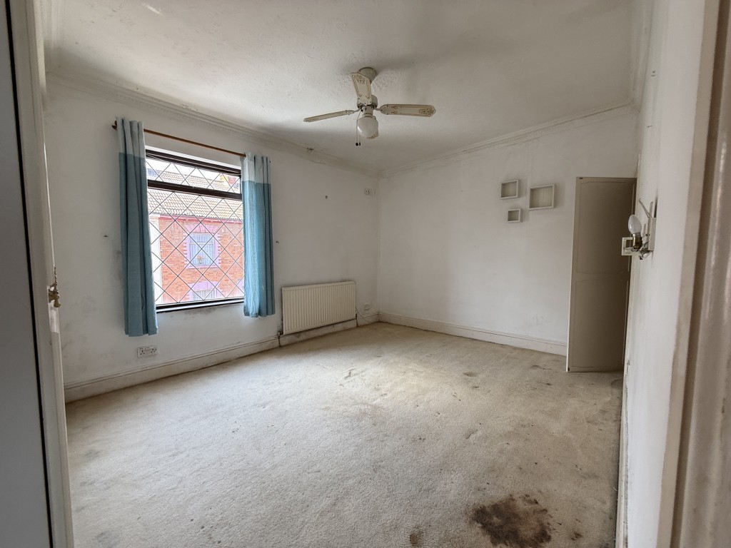 Lot: 93 - TWO-BEDROOM HOUSE REQUIRING IMPROVEMENT CLOSE TO TOWN CENTRE - Bedroom one